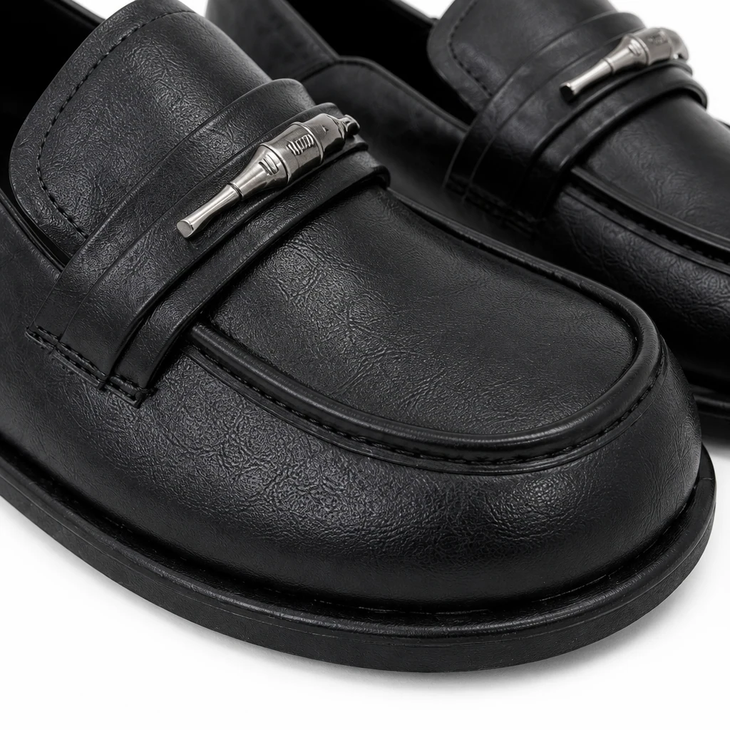 Close-up detail of the rounded toe loafer material and stitching