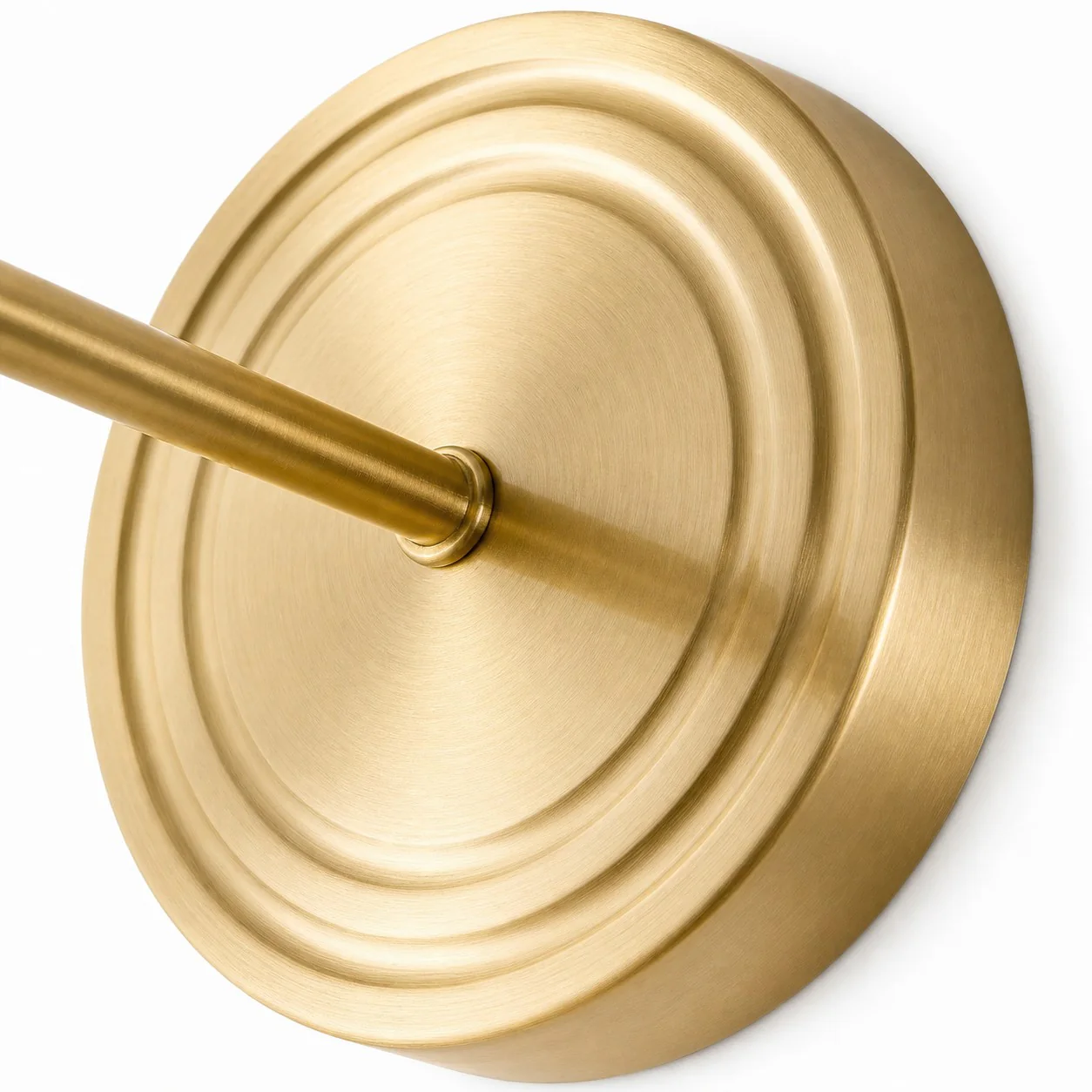 Close view of the brushed brass-toned wall plate